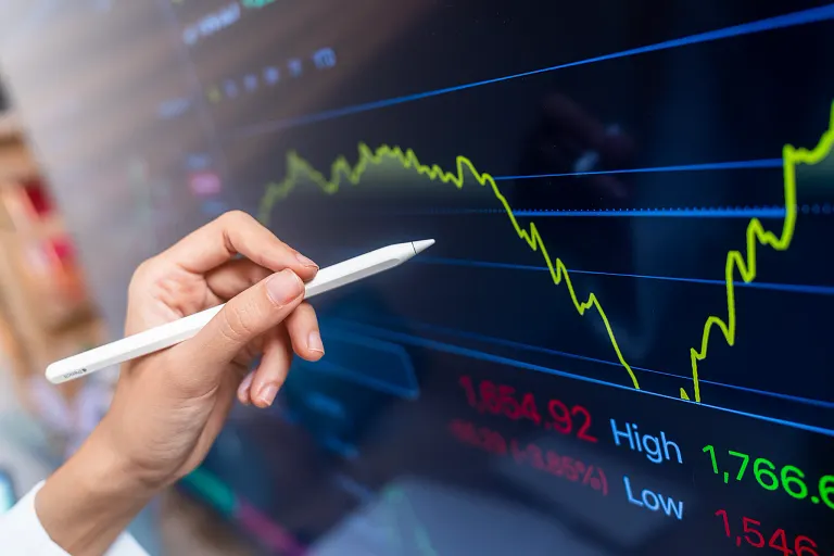 Apple pencil pointing to a graph